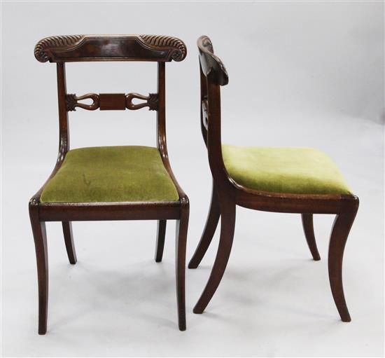 A set of six early 19th century mahogany dining chairs,